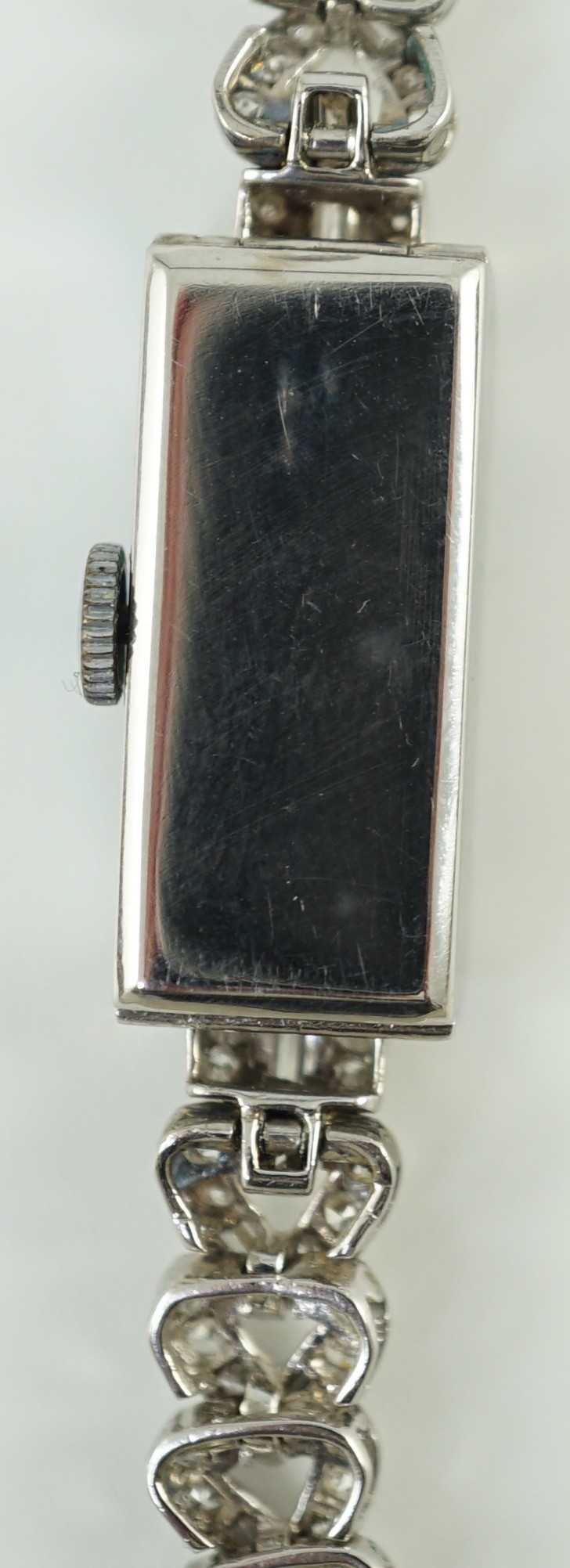 A lady's 1930's/1940's platinum, baguette and round cut diamond set rectangular dial manual wind cocktail watch, on a white gold and baguette and round cut diamond set bracelet, with Asprey box